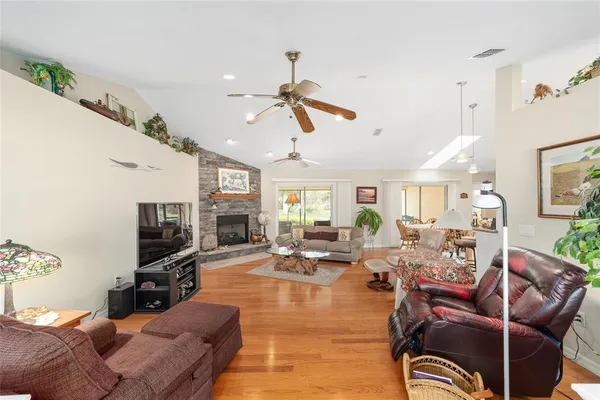 a living room with furniture a window and a fireplace