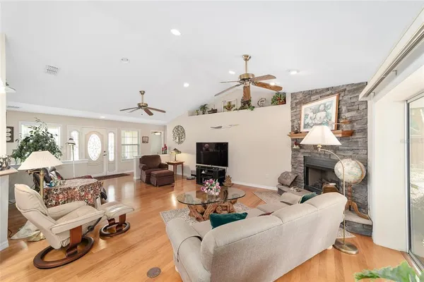 a living room with furniture and a book shelf