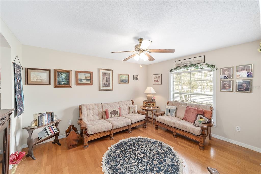 2320 Southeast 33rd Street Ocala, FL 34471 - Photo 17 of 67 a living room with furniture and a table