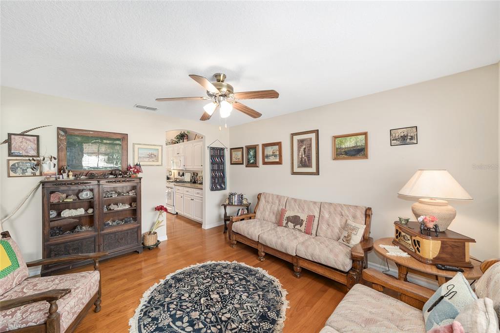2320 Southeast 33rd Street Ocala, FL 34471 - Photo 19 of 67 a living room with furniture and a flat screen tv