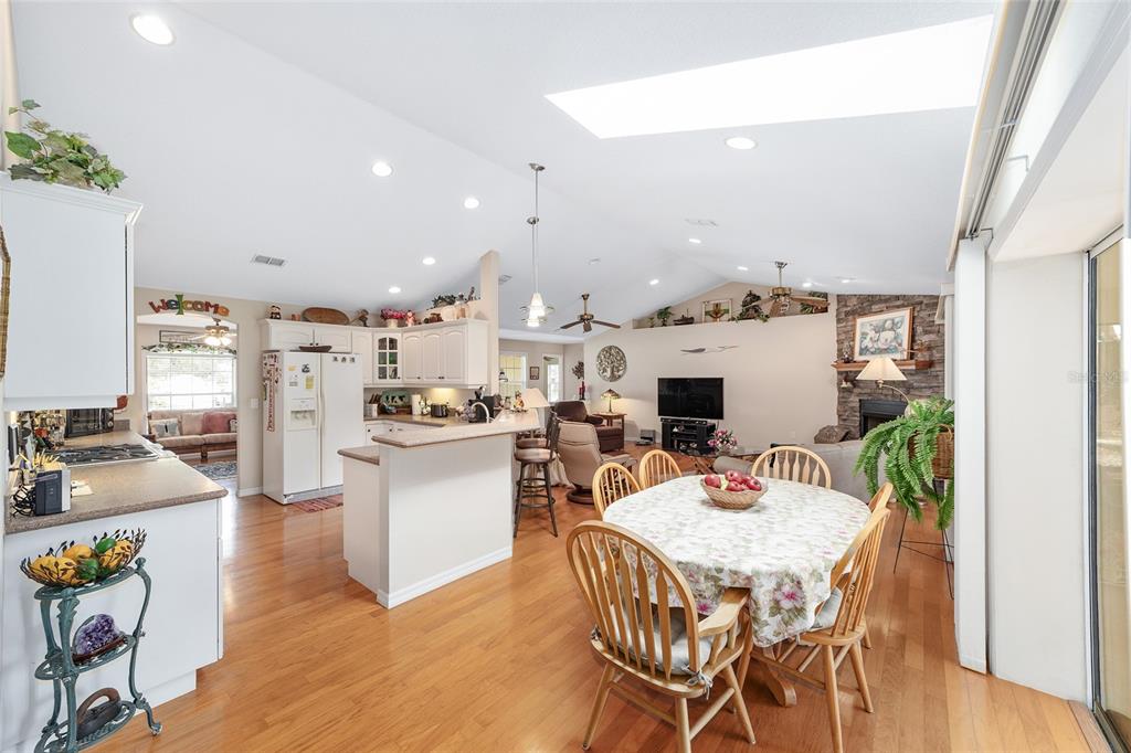 2320 Southeast 33rd Street Ocala, FL 34471 - Photo 25 of 67 a view of a dining room with furniture and wooden floor