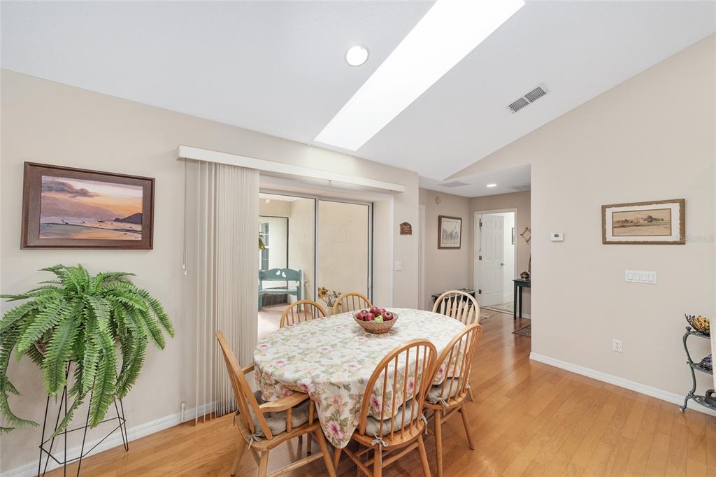 2320 Southeast 33rd Street Ocala, FL 34471 - Photo 26 of 67 a view of a dining room with furniture and wooden floor
