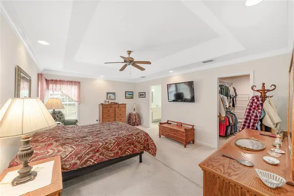 a bedroom with furniture and a chair