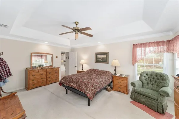 a bed room with two bed and a window