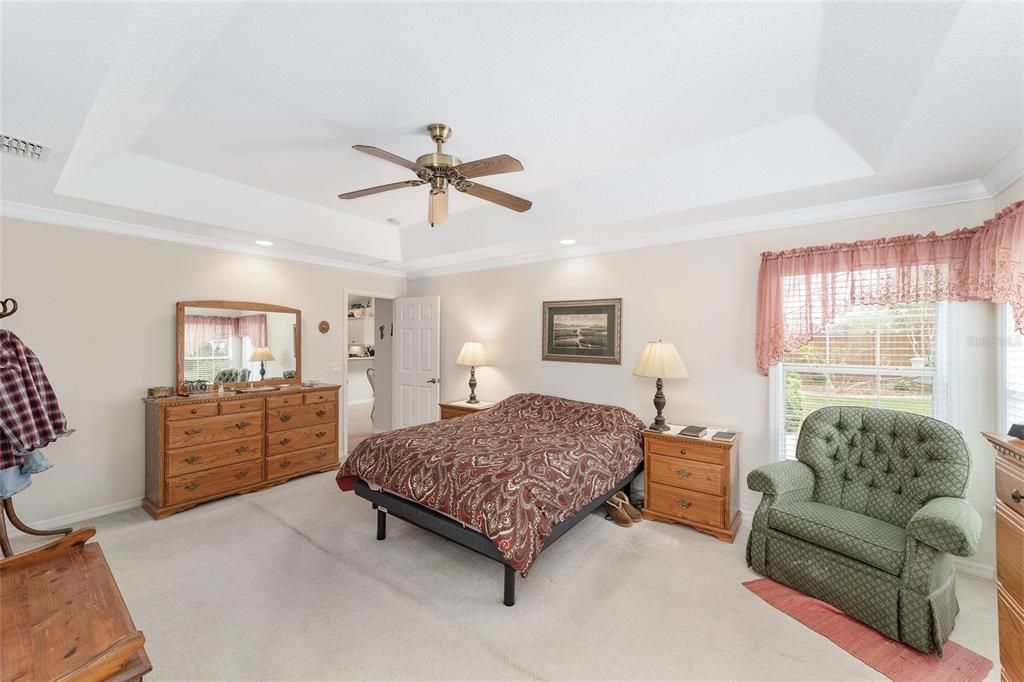 2320 Southeast 33rd Street Ocala, FL 34471 - Photo 29 of 67 a bedroom with a bed a couch and dresser