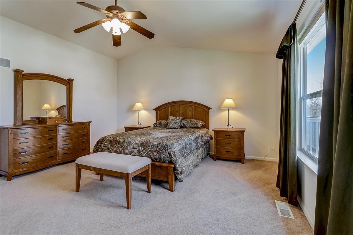 231 Ridge Road North Aurora, IL 60542 - Photo 14 of 31 a bedroom with a bed and a dresser