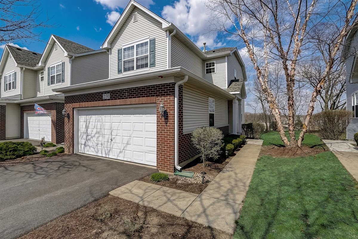 231 Ridge Road North Aurora, IL 60542 - Photo 29 of 31 a front view of a house with a yard and garage
