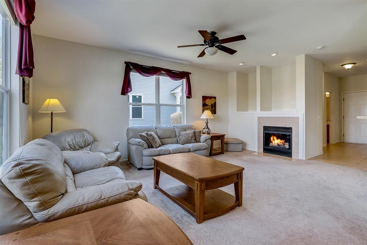 231 Ridge Road North Aurora, IL 60542 - Photo 4 of 31 a living room with furniture and a fireplace