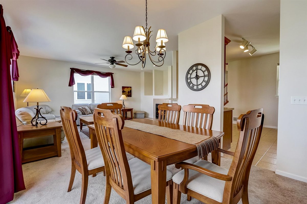 231 Ridge Road North Aurora, IL 60542 - Photo 7 of 31 a view of a dining room with furniture and chandelier