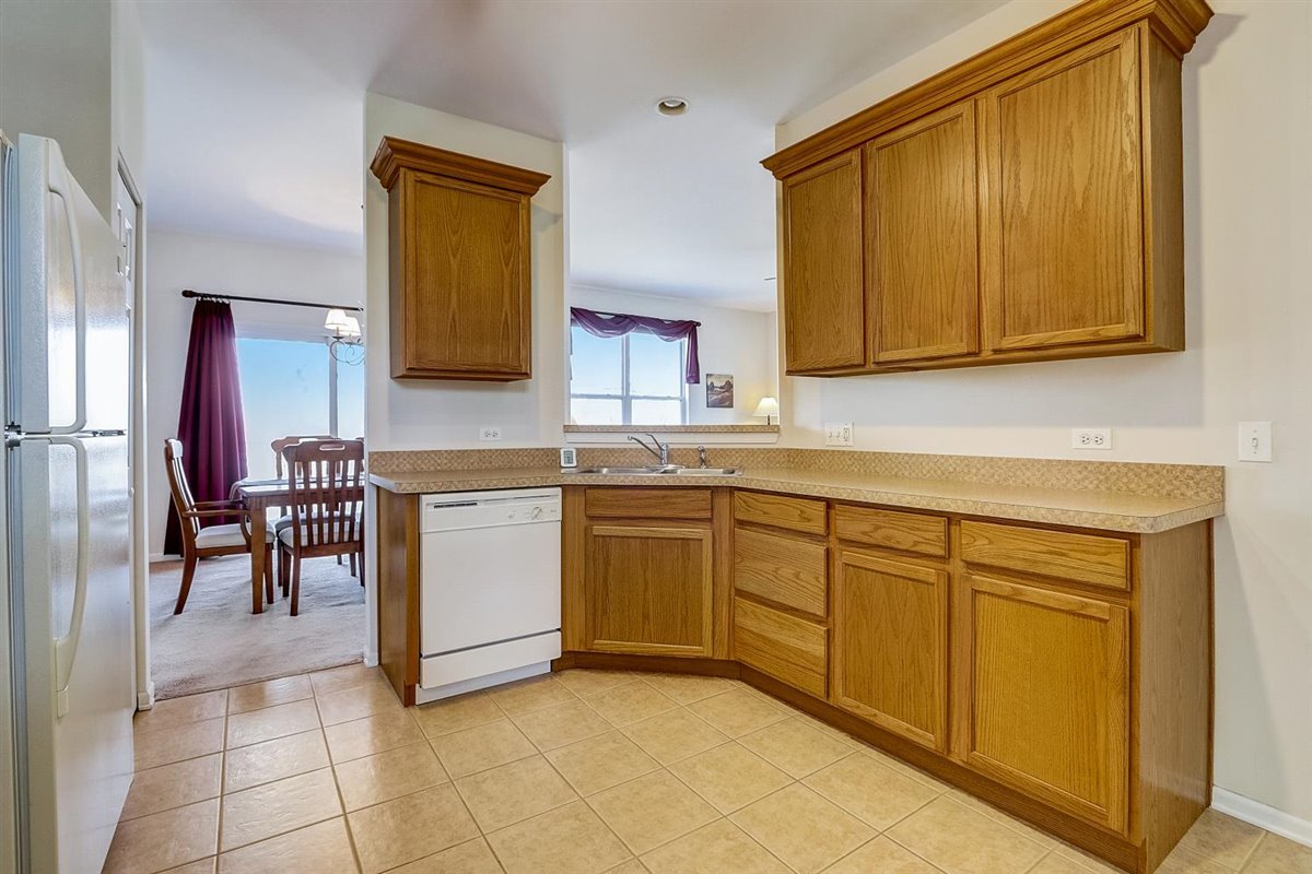 231 Ridge Road North Aurora, IL 60542 - Photo 9 of 31 a kitchen with a sink and a stove top oven