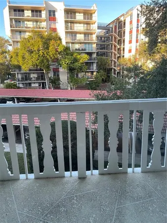 a couple of cars parked in front of building