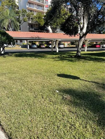 a front view of a building with garden