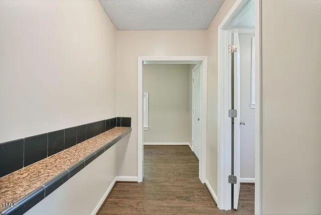 a view of bedroom and hallway