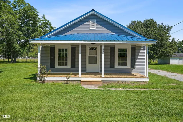 a view of a house with a garden