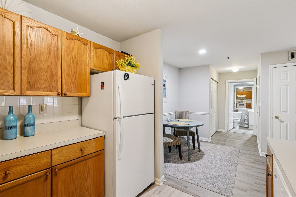 31183 Paradise Cmns, Unit 713 Fernandina Beach, FL 32034 - Photo 13 of 35 a white refrigerator freezer sitting in a kitchen