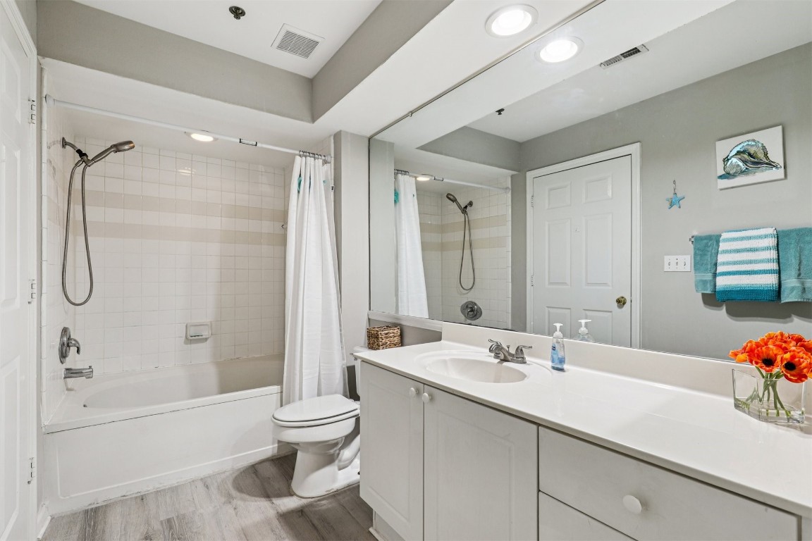 31183 Paradise Cmns, Unit 713 Fernandina Beach, FL 32034 - Photo 21 of 35 a bathroom with a sink toilet tub and shower