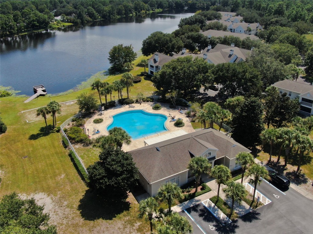 31183 Paradise Cmns, Unit 713 Fernandina Beach, FL 32034 - Photo 28 of 35 an aerial view of a house with a lake view