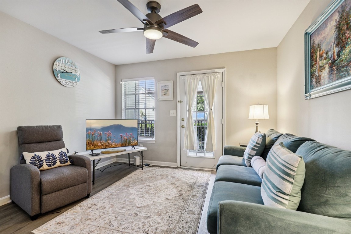 31183 Paradise Cmns, Unit 713 Fernandina Beach, FL 32034 - Photo 5 of 35 a living room with furniture and a flat screen tv