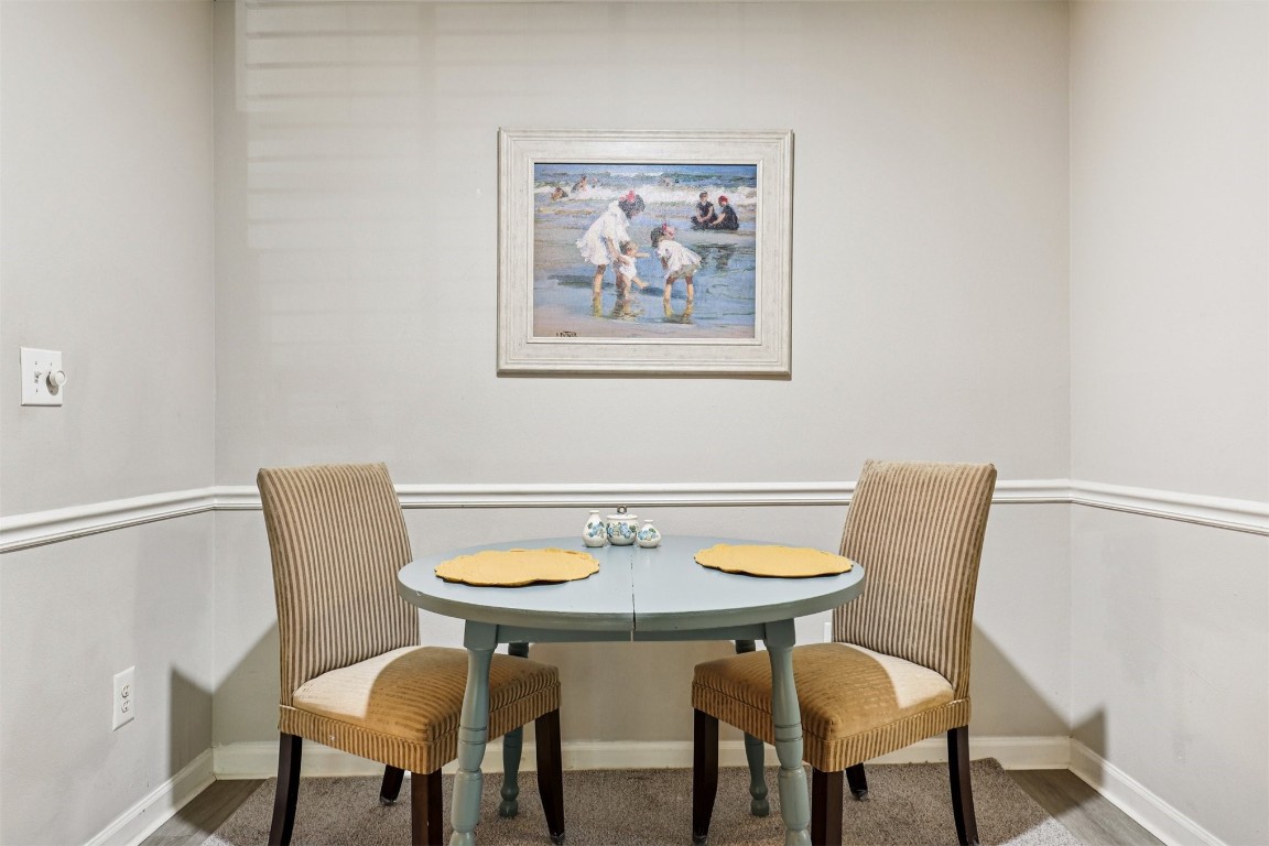 31183 Paradise Cmns, Unit 713 Fernandina Beach, FL 32034 - Photo 10 of 35 a view of a dining room with furniture and wooden floor