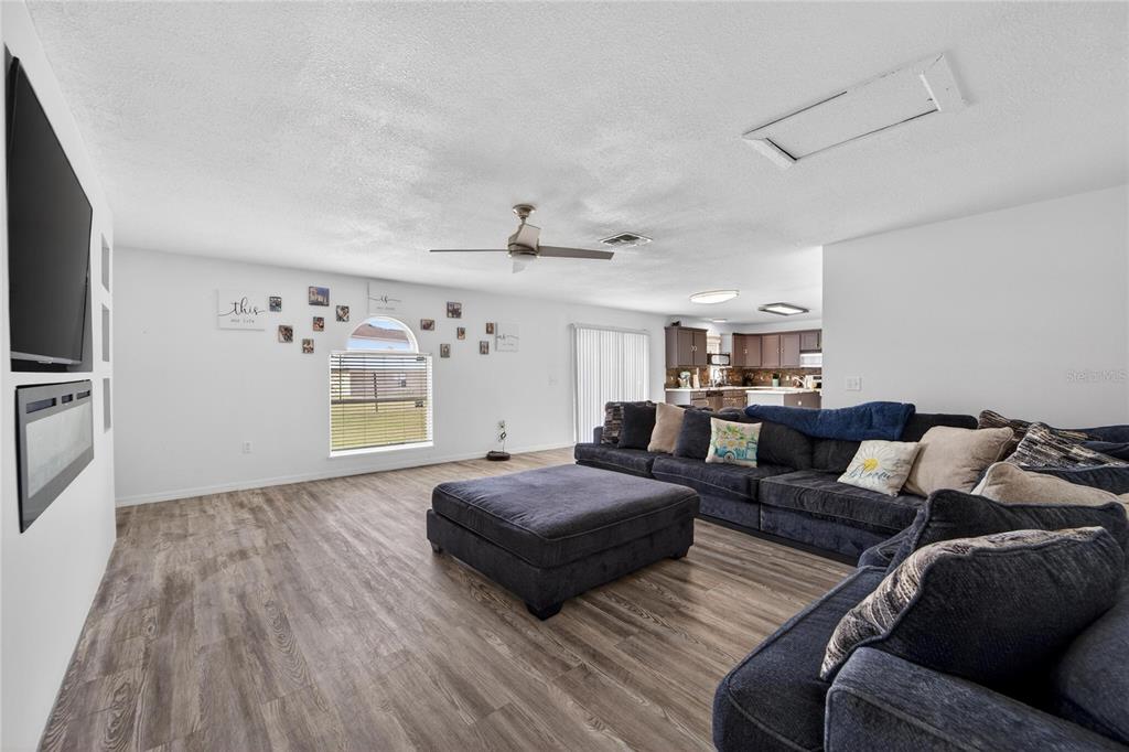 10325 Frog Pond Drive Riverview, FL 33569 - Photo 20 of 53 a living room with furniture and a flat screen tv