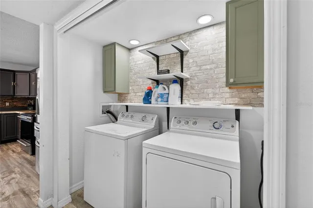 a living room with a bed furniture and a window