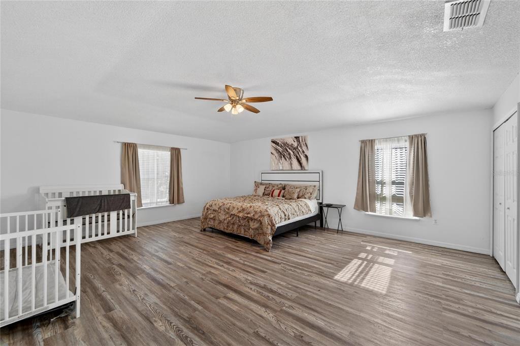 10325 Frog Pond Drive Riverview, FL 33569 - Photo 26 of 53 a living room with a bed furniture and a window
