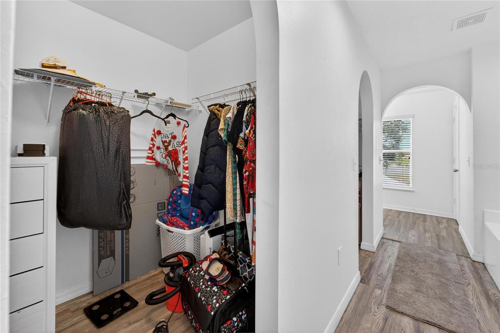 10325 Frog Pond Drive Riverview, FL 33569 - Photo 30 of 53 a view of walk in closet with clothes and shoes