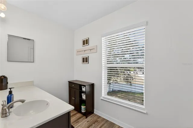 a white toilet sitting next to a shower curtain