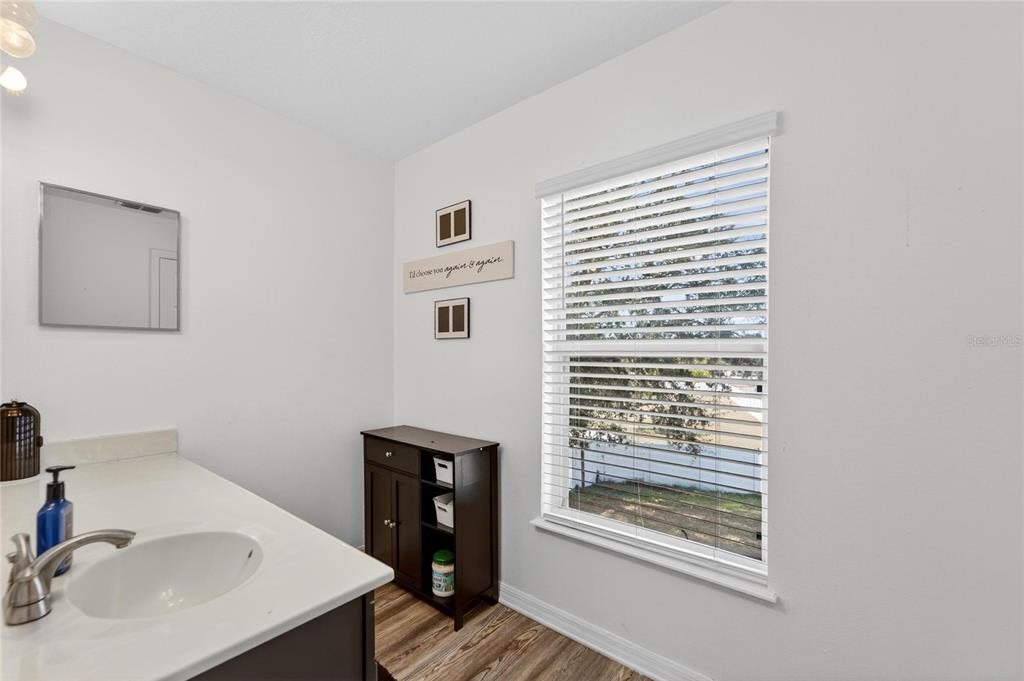 10325 Frog Pond Drive Riverview, FL 33569 - Photo 31 of 53 a bathroom with a sink and a window