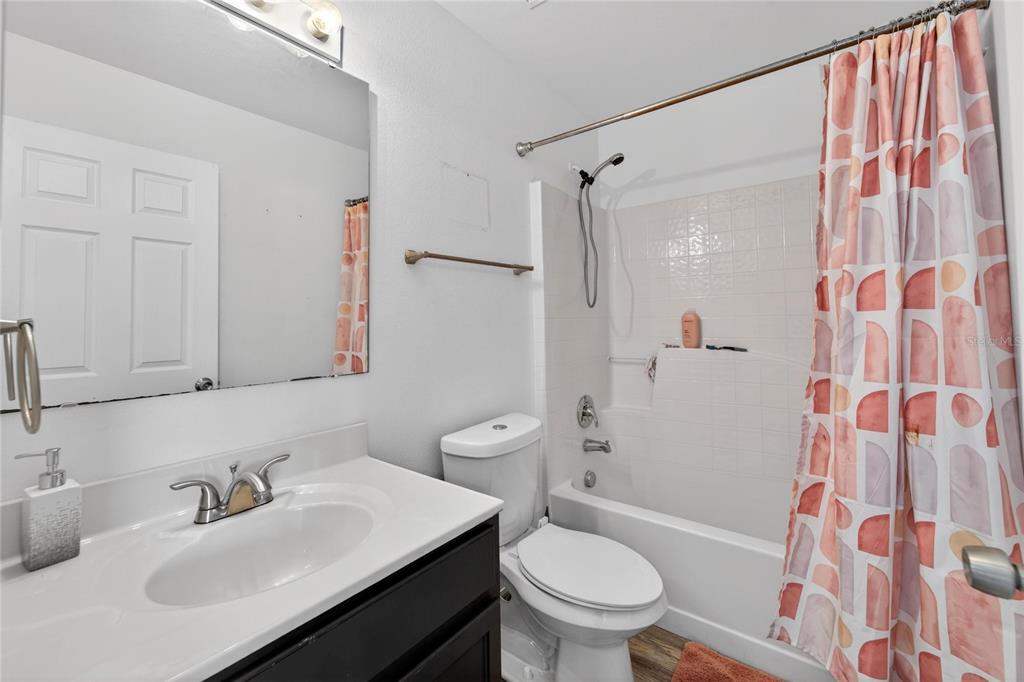 10325 Frog Pond Drive Riverview, FL 33569 - Photo 36 of 53 a bathroom with a sink toilet and shower