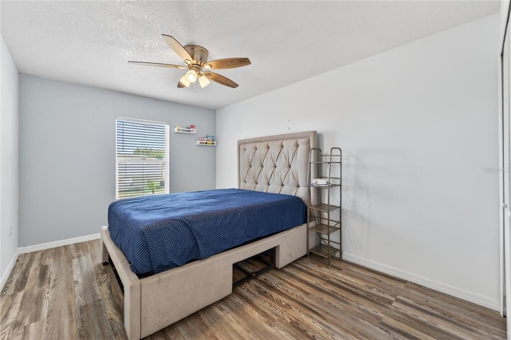 10325 Frog Pond Drive Riverview, FL 33569 - Photo 39 of 53 a bedroom with a bed and window