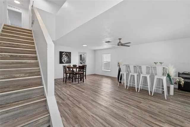 a view of dining room with furniture and wooden floor