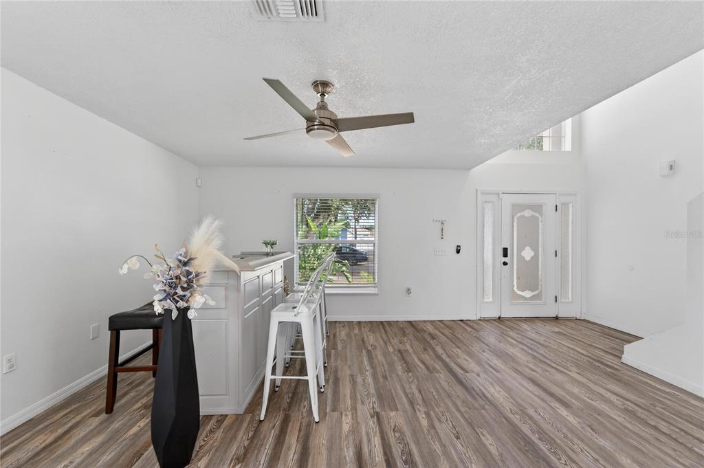 10325 Frog Pond Drive Riverview, FL 33569 - Photo 5 of 53 a view of a livingroom with wooden floor