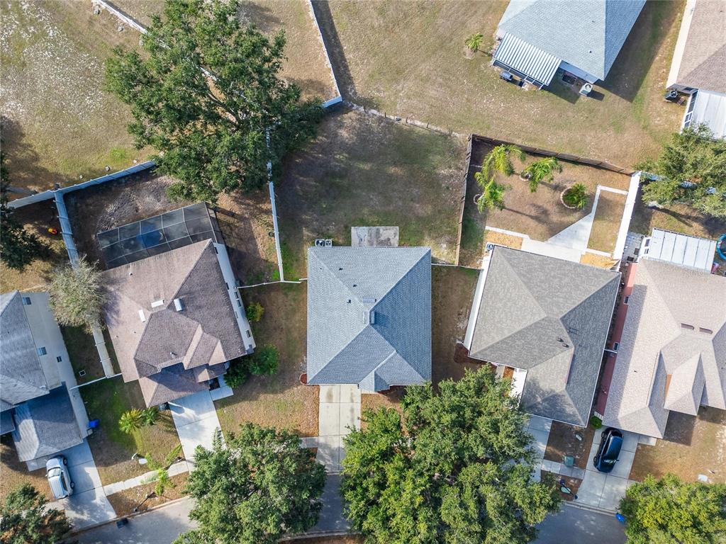 10325 Frog Pond Drive Riverview, FL 33569 - Photo 51 of 53 an aerial view of a house with a yard and a large tree