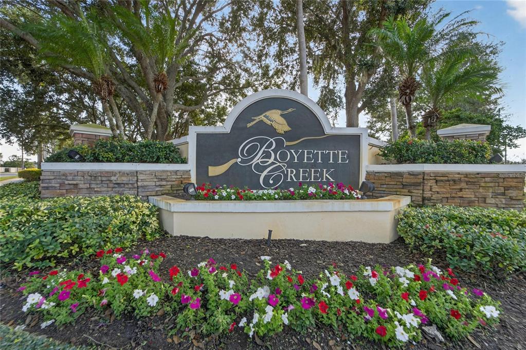 10325 Frog Pond Drive Riverview, FL 33569 - Photo 53 of 53 a view of a sign board with flower garden