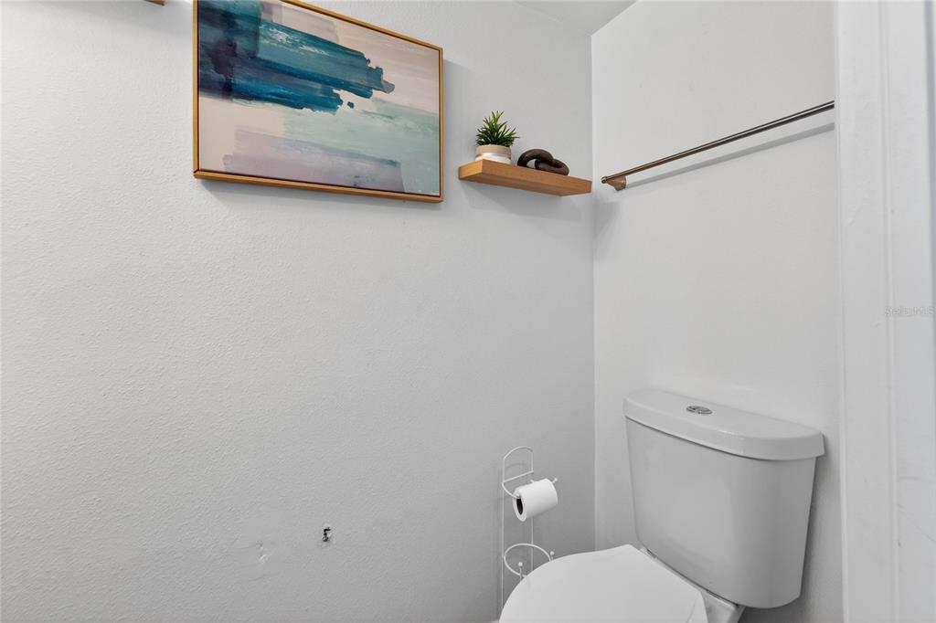 10325 Frog Pond Drive Riverview, FL 33569 - Photo 10 of 53 a white toilet sitting next to a shower