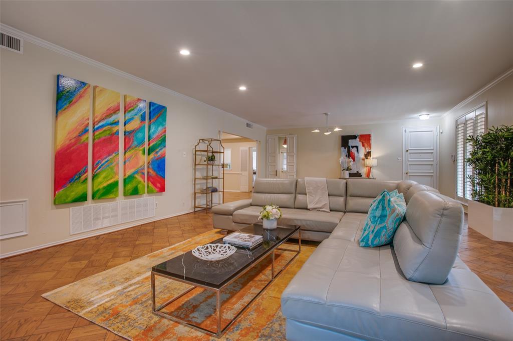 6314 Bandera Avenue, Unit C Dallas, TX 75225 - Photo 1 of 40 a living room with furniture and painting on the wall