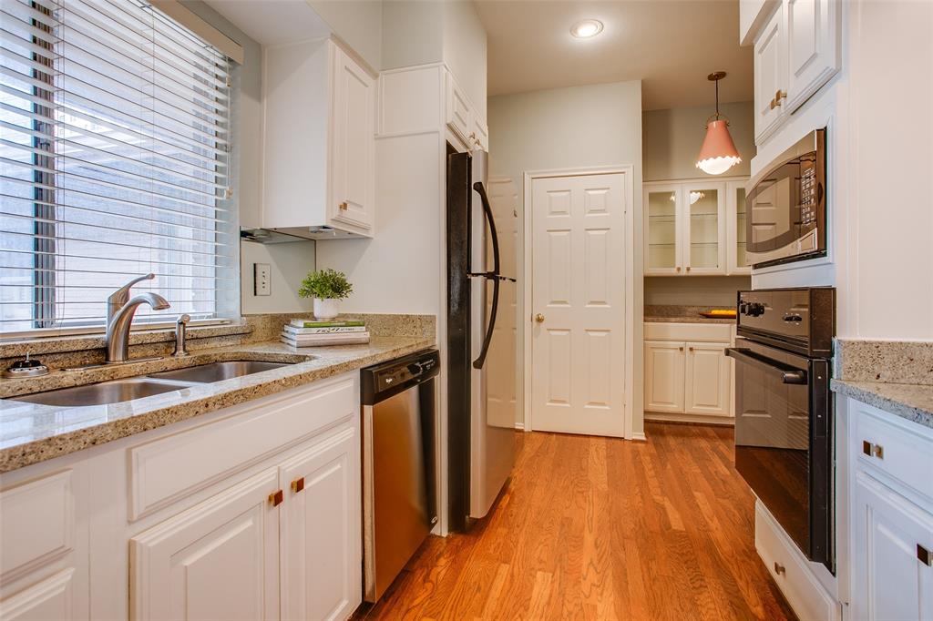 6314 Bandera Avenue, Unit C Dallas, TX 75225 - Photo 23 of 40 a kitchen with stainless steel appliances granite countertop a sink stove and refrigerator