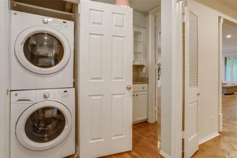 a view of a hallway with washer and dryer