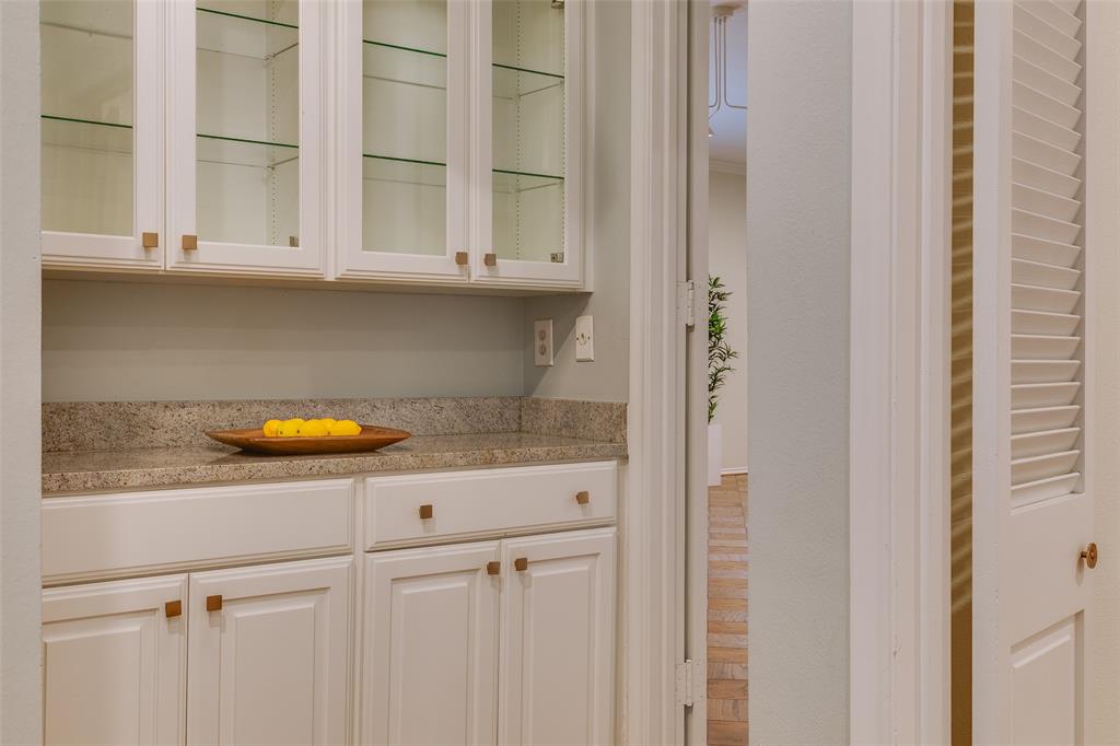6314 Bandera Avenue, Unit C Dallas, TX 75225 - Photo 26 of 40 a kitchen with a sink and cabinets