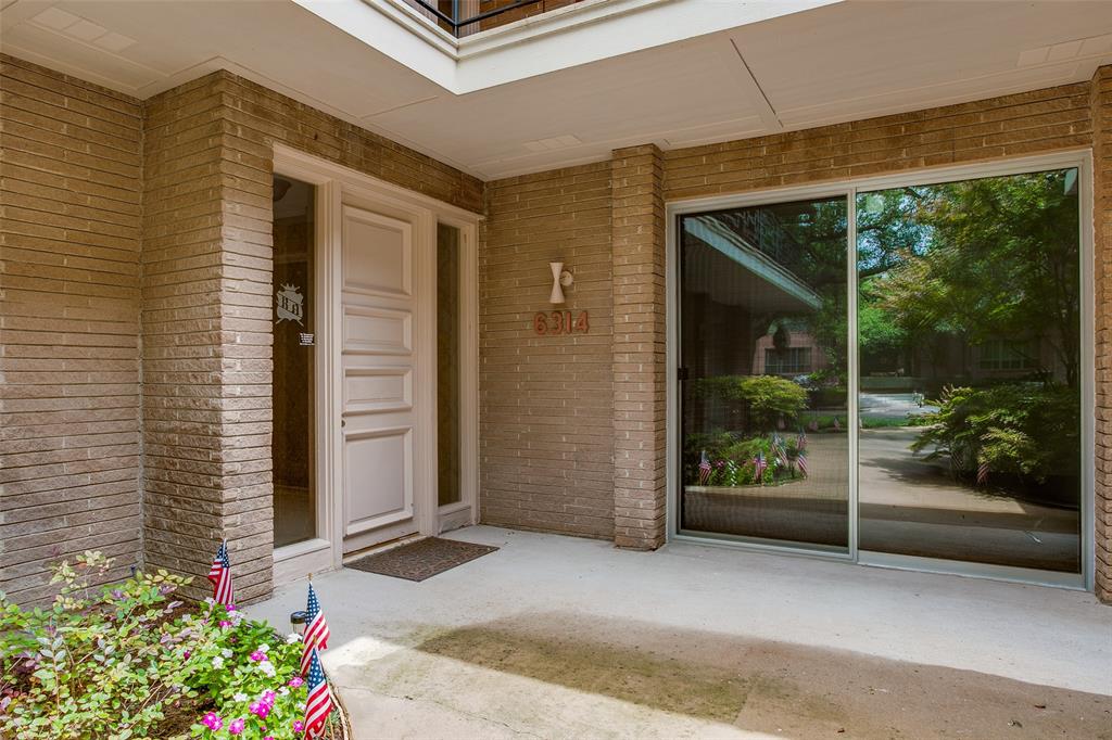 6314 Bandera Avenue, Unit C Dallas, TX 75225 - Photo 3 of 40 a front view of a house with porch