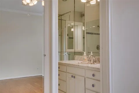 a bathroom with a granite countertop sink mirror and double