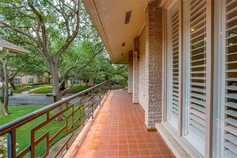 a view of balcony with wooden floor