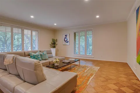 a living room with furniture and windows
