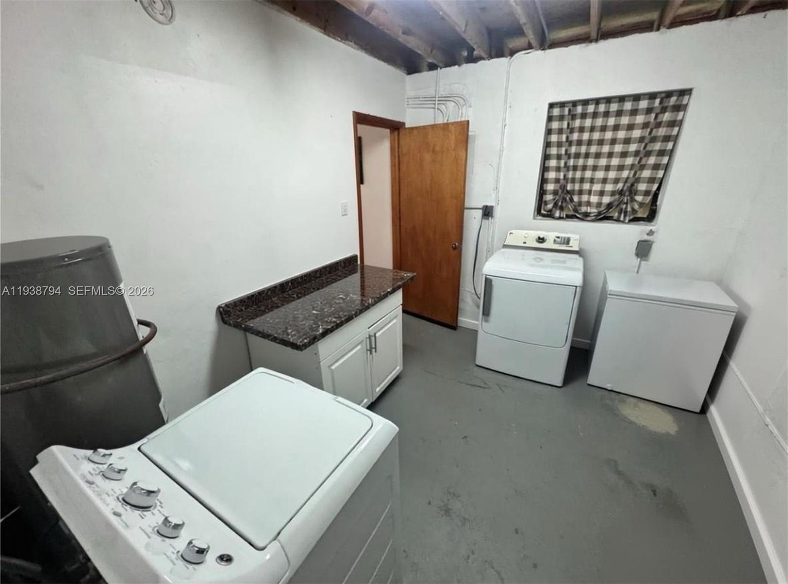 9955 Southwest 214th Street Cutler Bay, FL 33189 - Photo 10 of 15 a utility room with dryer and washer