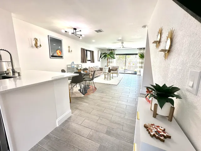 a view of living room with furniture and a flat screen tv