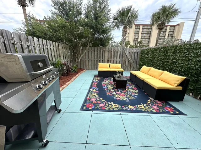 a view of a door with brick walls