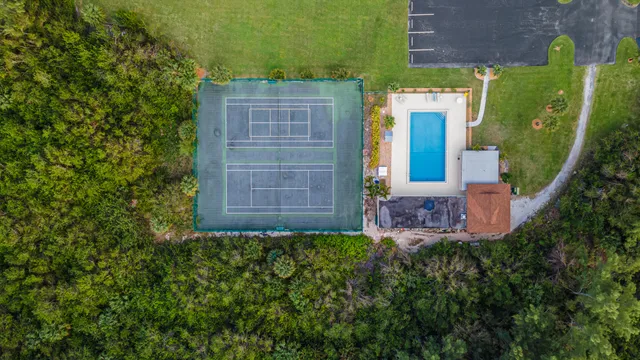 a view of balcony with mountain view and wooden floor