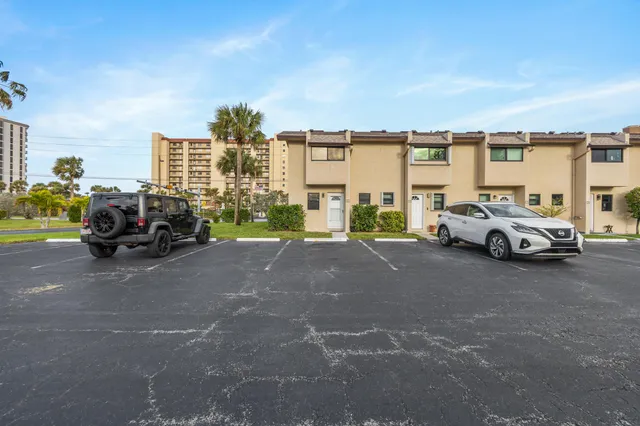 a view of a balcony with wooden floor