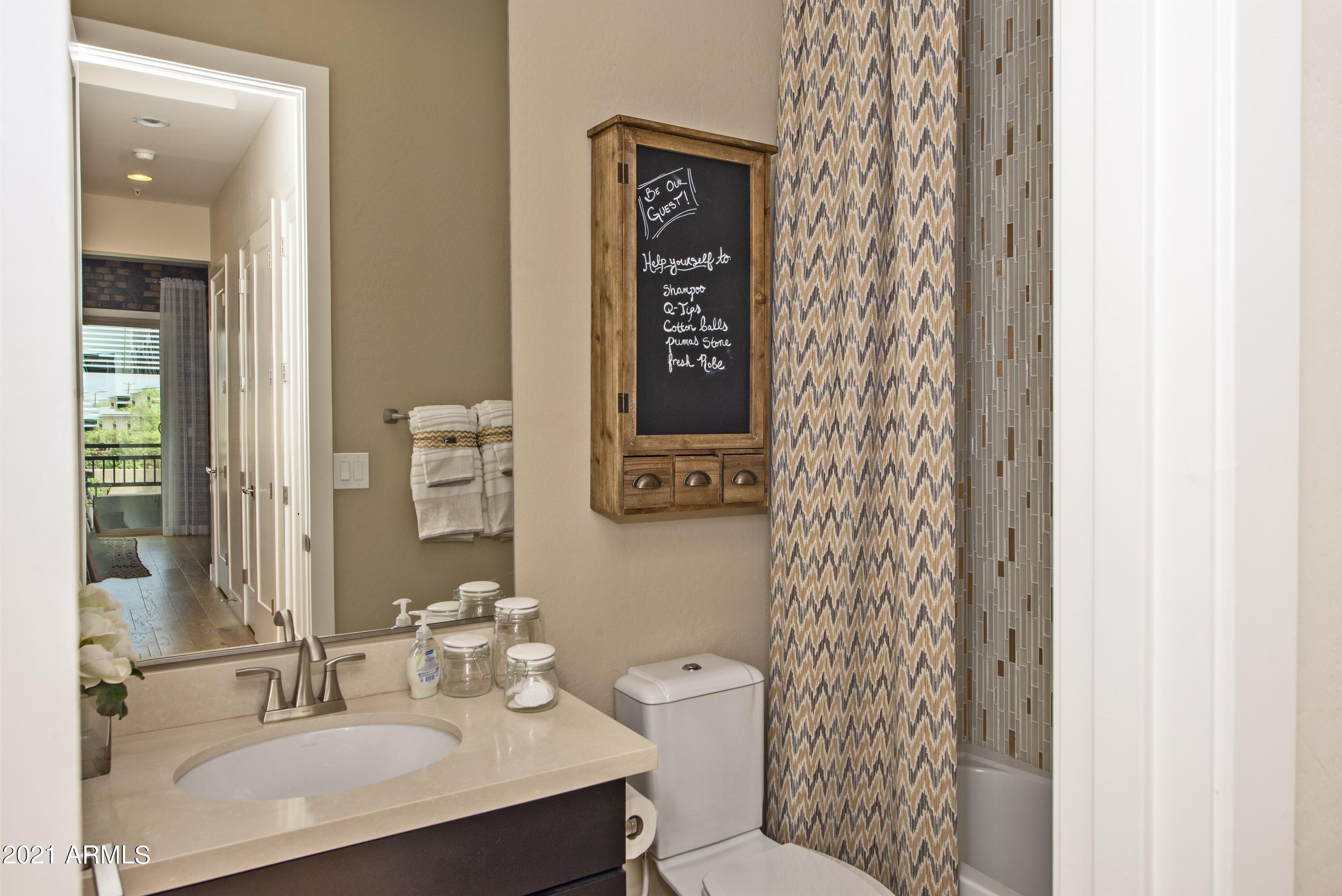 6565 East Thomas Road, Unit 1042 Scottsdale, AZ 85251 - Photo 13 of 22 a bathroom with a sink toilet and shower